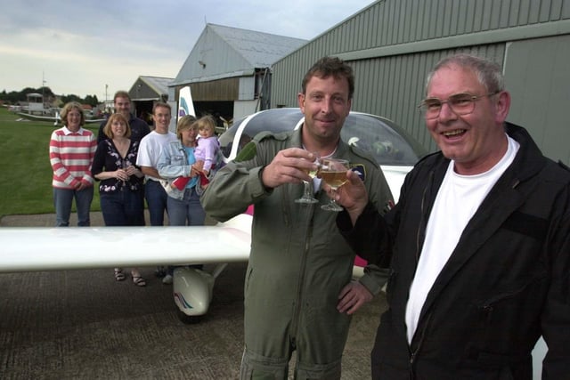 Raymond Clegg, 67, and co-pilot Nick Riddin, 37, celebrate with friends on August 15, 2003 after arriving at Netherthorpe Airfield following a remarkable transatlantic flight. Raymond, a retired Hallamshire Hospital ear, nose and throat consultant, teamed up with Nick to fly from Sheffield to Wisconsin, in the US, and back, in a DIY plane Raymond had built himself.