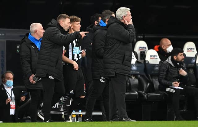 Newcastle substitute Matt Ritchie is given instructions before coming on from coach Graeme Jones as manager Steve Bruce looks on. (Photo by Stu Forster/Getty Images)