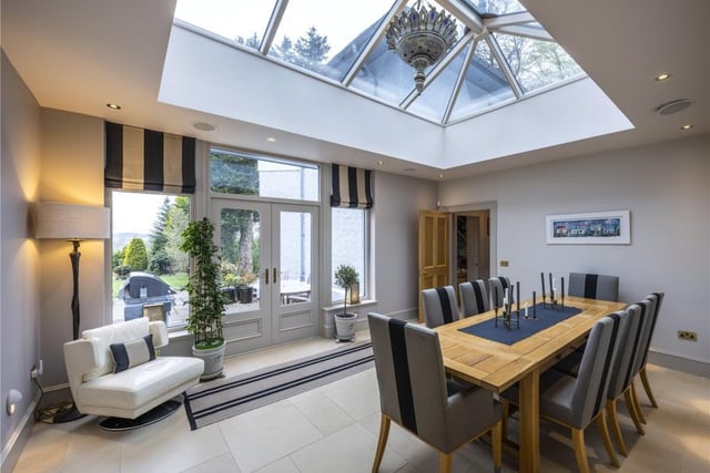 The stunning orangery brings the outdoors in with garden and mountain views.