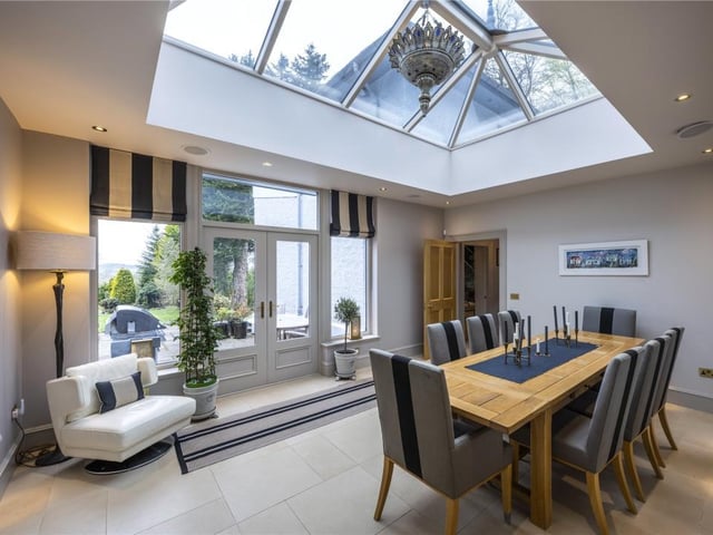 The stunning orangery brings the outdoors in with garden and mountain views.