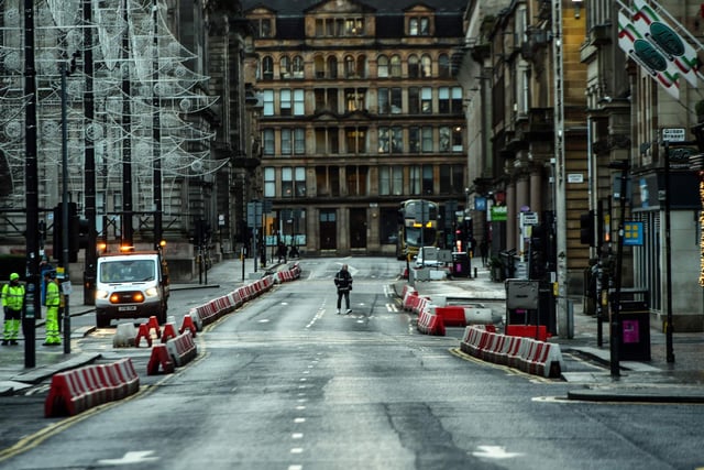 Pedestrians walk through central Glasgow as Britain enters a national lockdown