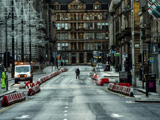 Pedestrians walk through central Glasgow as Britain enters a national lockdown