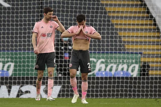 Sheffield United's George Baldock and Chris Basham react after Leicester scored their fourth goal (Molly Darlington/Pool via AP)