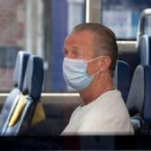 The mandatory wearing of face masks on public transport and in shops has become a divisive issue among some across the UK (Photo by Matthew Horwood/Getty Images)