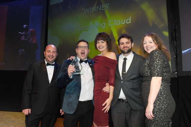 Cllr Steve Pitt from Portsmouth City Council with winner of the Medium Business of the Year Award My Learning Cloud.
(210220-8418)