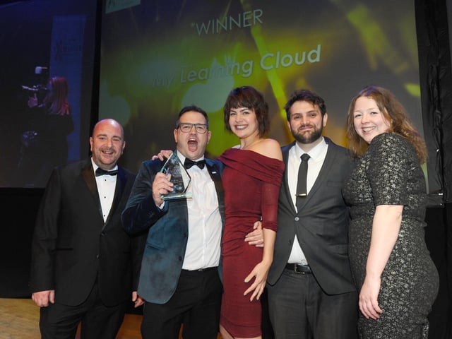 Cllr Steve Pitt from Portsmouth City Council with winner of the Medium Business of the Year Award My Learning Cloud.
(210220-8418)