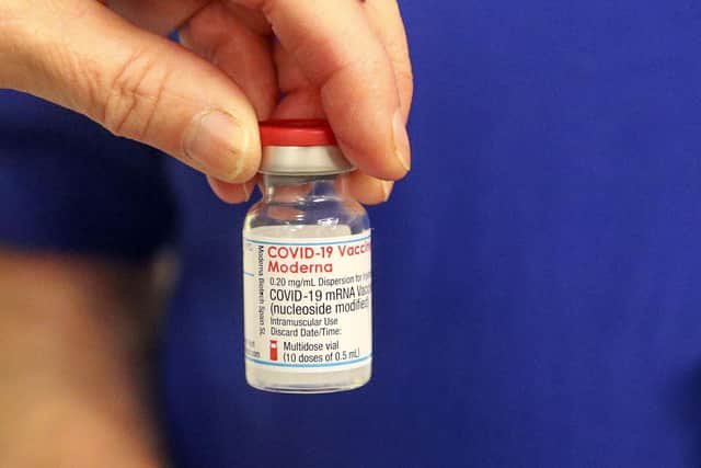 A vial of the Moderna Covid-19 vaccine is prepared at the vaccination centre at the Madejski Stadium in Reading, Berkshire (Photo: Steve Parsons/PA Wire).