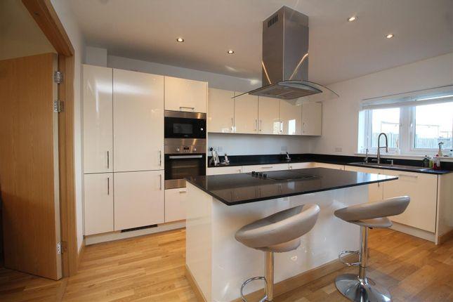 This spacious open plan kitchen/dining room area is fully kitted out, and immaculately finished. Featuring an island unit with electric oven and gas hob plus an extractor unit, quartz work tops, and integrated dishwasher and fridge/freezer.