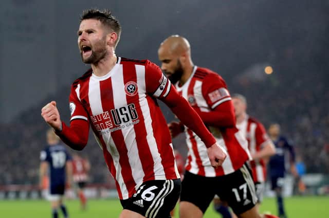 Sheffield United's Oliver Norwood (left) celebrates scoring his side's first goal of the game during the Premier League match at Bramall Lane, Sheffield. PA Photo. Picture date: Thursday December 26, 2019. See PA story SOCCER Sheff Utd. Photo credit should read: Mike Egerton/PA Wire. RESTRICTIONS: EDITORIAL USE ONLY No use with unauthorised audio, video, data, fixture lists, club/league logos or "live" services. Online in-match use limited to 120 images, no video emulation. No use in betting, games or single club/league/player publications.