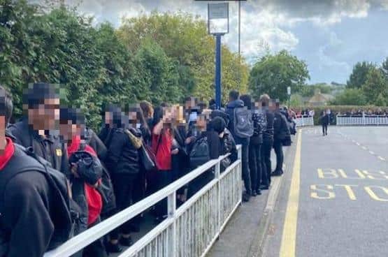 School pupils could face long waits to get home due to significant cuts to school bus services, fears a Sheffield headteacher. The picture shows children queueing at King Ecgbert School