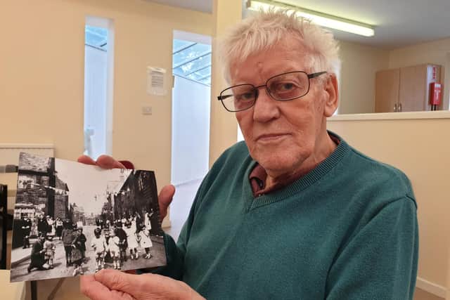 Brian Platts with a photo taken of him and his twin Bruce in the 1930s.