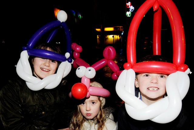 Although the wee one in the middle doesn't look sure about it - the Christmas light switch on events were always fun for all the family
