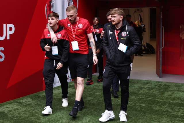 Tommy Doyle (right) and James McAtee (left) with Sheffield United team mate Oli McBurnie at Wembley: Darren Staples / Sportimage