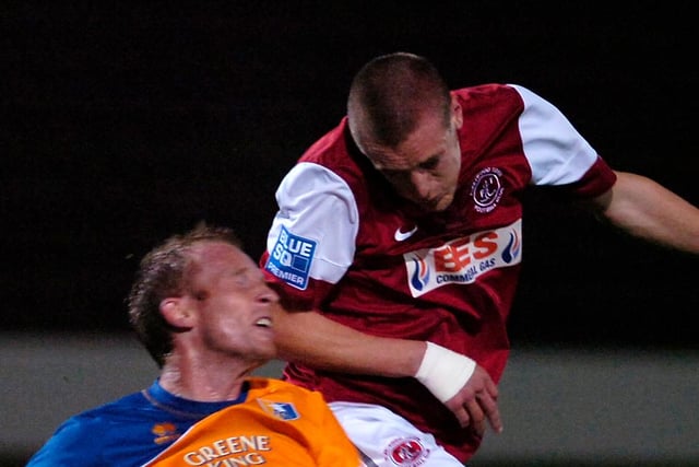 Paul Bolland, pictured challenging Jamie Vardy for a header,  signed for Stags on 1 June 2011. He struggled to hold down a first team place and made 10 first team appearances which saw him have two loan spells at Harrogate during that time.