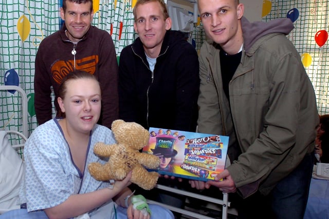 Nick Fenton, Andy Roberts and Stephen Roberts are pictured with 15-year-old Katrina Millward of Balby during their visit to DRI Children's Hospital at Christmas 2005