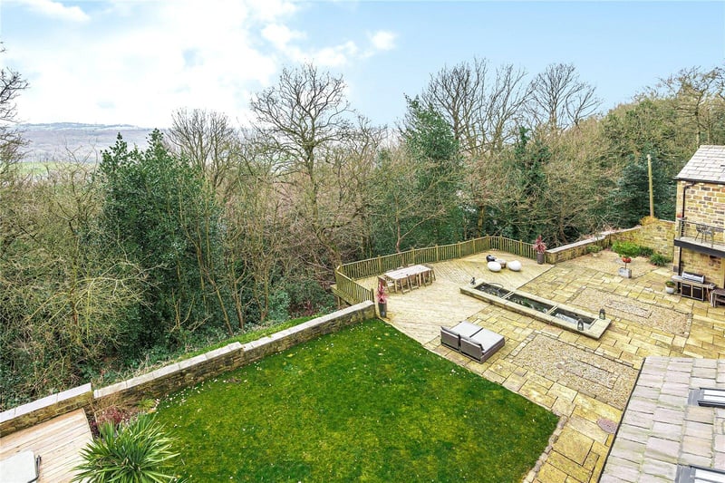To the rear of the property are low maintenance private gardens, which are mostly gravelled and flagged, with a lawned area as well, plus excellent woodland views.