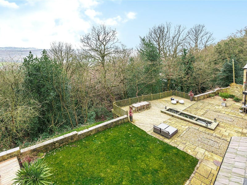 To the rear of the property are low maintenance private gardens, which are mostly gravelled and flagged, with a lawned area as well, plus excellent woodland views.
