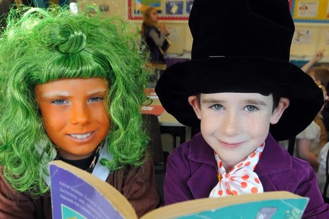Cameron Wells and Niamh Todd, both 7, enjoy a book on Roald Dahl Day in 2014.