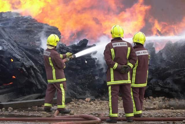 File picture shows Sheffield firefighters. Firefighters were called after arsonists set a mini digger alight in a compound near Manor, Sheffield
