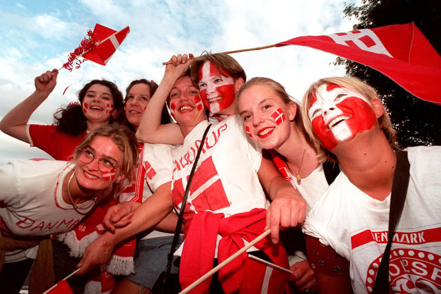 Danish fans smile for the camera outside Hillsborough ground.