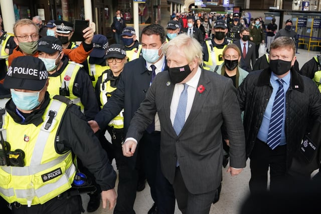 Prime Minister Boris Johnson was escorted by police after he arrived by train from London at Glasgow Central station on his return to the city for meetings at the Cop26 summit.  Photo credit: Andrew Milligan/PA Wire