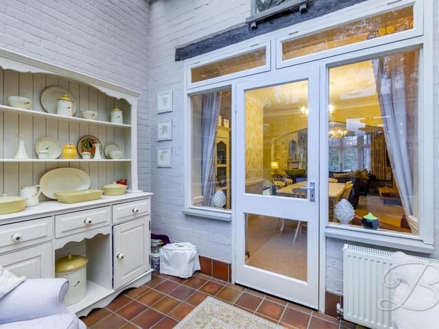 Another view of the conservatory shows that it is very much a lived-in room in its own right, and not just an add-on. It also leads directly into the open-plan living and dining area of the house.