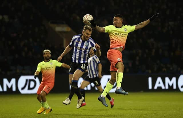 SHEFFIELD, ENGLAND - MARCH 04:  Gabriel Jesus of Manchester City battles for possession with Tom Lees of Sheffield Wednesday during the FA Cup Fifth Round match between Sheffield Wednesday and Manchester City at Hillsborough on March 04, 2020 in Sheffield, England.  (Photo by Clive Brunskill/Getty Images)