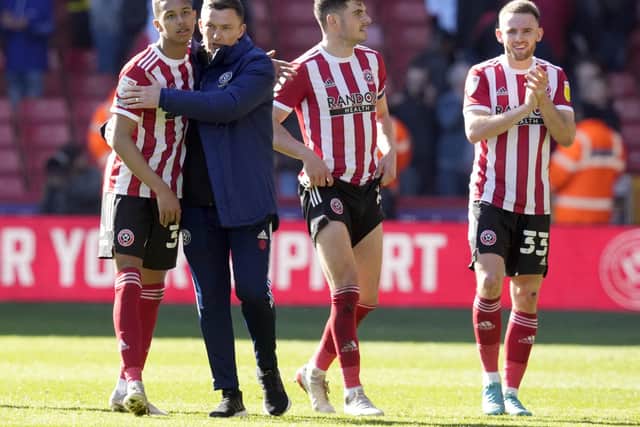 Sheffield United youngster Kyron Gordon with Sheffield United manager Paul Heckingbottom: Andrew Yates / Sportimage