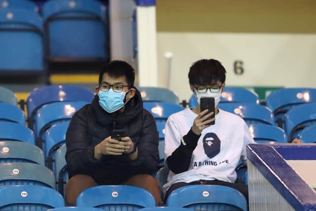 Fans wear a disposable face mask prior to the FA Cup Fifth Round match between Sheffield Wednesday and Manchester City at Hillsborough.