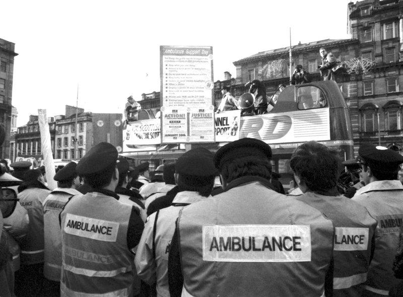 A demonstration and rally to support the ambulance workers' strike gathers in George Square Glasgow, January 1990.