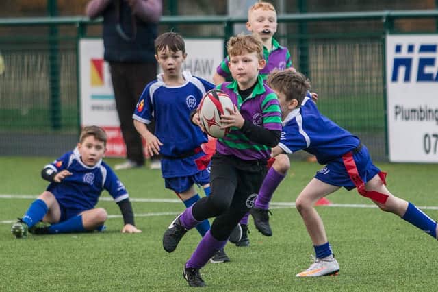 Lachlan Graham in action for Wilton Primary at Hawick's youth rugby festival on Friday