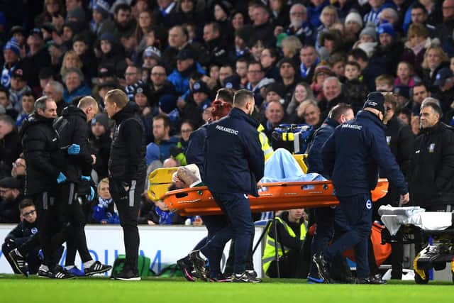 Steven Fletcher is stretchered off the pitch with a knee injury in Sheffield Wednesday's 1-0 FA Cup win over Brighton.