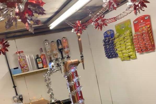 Cayleigh Hardwick isn't playing around with her home bar - she even has bags of nuts on the wall!