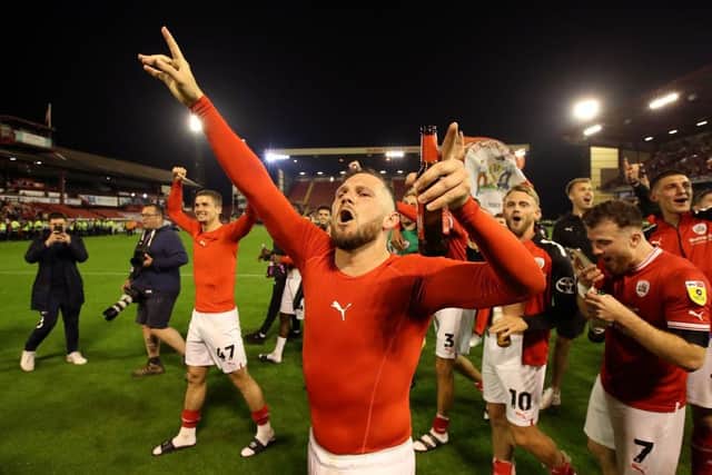 BARNSLEY, ENGLAND - MAY 19: James Norwood of Barnsley celebrates victory following the Sky Bet League One Play-Off Semi-Final Second Leg match between Barnsley and Bolton Wanderers at Oakwell Stadium on May 19, 2023 in Barnsley, England. (Photo by George Wood/Getty Images)
