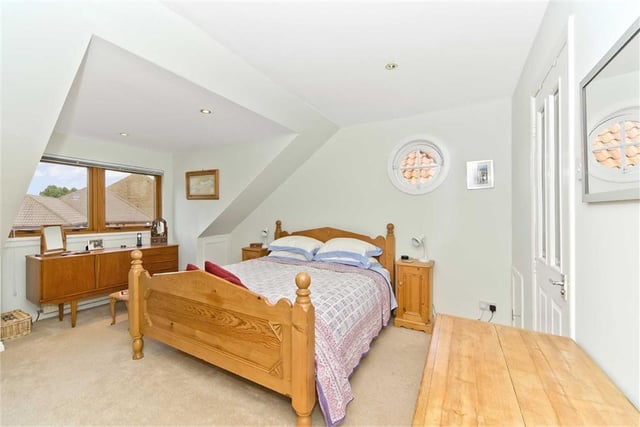 One of the four bedrooms this house boasts - and another one of those sweet windows.