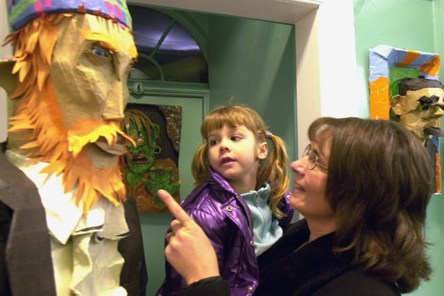 Andrea Fereday points out one of the sculptures to grandaughter  Laura Smith  at the Clifton Park Museum in February 2001