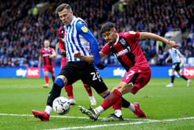 Sheffield Wednesday's Florian Kamberi (left) and Gillingham's Bailey Akehurst battle for the ball during the Sky Bet League One match at Hillsborough, Sheffield. Picture date: Saturday November 13, 2021. PA Photo. See PA story SOCCER Sheff Wed. Photo: Zac Goodwin/PA Wire.