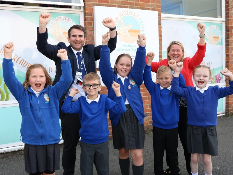 New Horizons Primary School achieved above the average standard in reading in its 2025 SATs results with a score of 103.
Pictured: Head of School, Mr Jones, and students.
