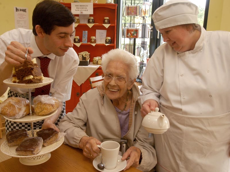 Regular customer Dolly Gozzard centre receives star treatment at Rumbles Café at Vicar Water Country Park. Also pictured are staff members Gavin Pearson and Diane Turton.