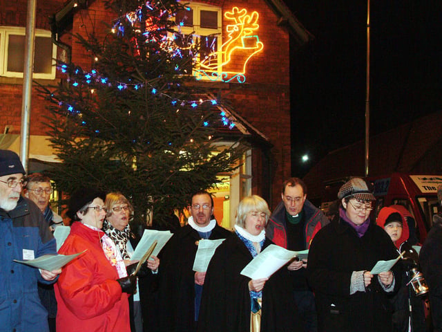 Warsop Christmas lights switch on in 2008.
Parish Church members take part in some carol singing.
