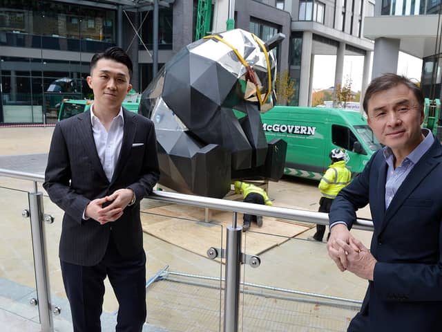Giant rooftop panda sculpture being installed at New Era Square Sheffield. Rongmin Qin executive director and Jerry Cheung MD New Era development UK.