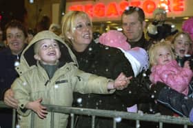 Tracy Barrett and 3-year-old son Luke Barrett from Halfway marveled at the fake snow at the Sheffield City Centre light switch on in 2001