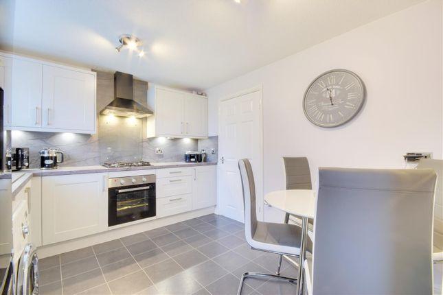 The property has a modern contemporary dining kitchen.