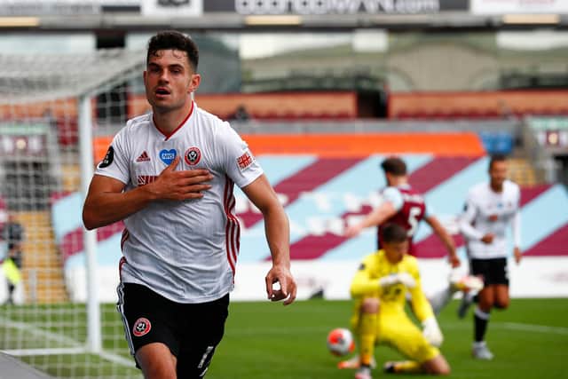 John Egan celebrates after scoring the equaliser for SHeffield United against Burnley - a goal that would earn the Blades a deserved point (Photo by CLIVE BRUNSKILL/POOL/AFP via Getty Images)