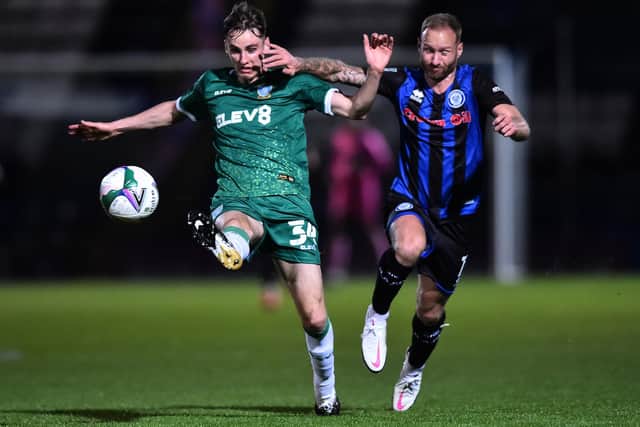 ROCHDALE, ENGLAND - SEPTEMBER 15: Ciaran Brennan of Rochdale and Matt Done of Sheffield Wednesday in action during the Carabao Cup Second Round match between Rochdale and Sheffield Wednesday at Crown Oil Arena on September 15, 2020 in Rochdale, England. (Photo by Nathan Stirk/Getty Images)