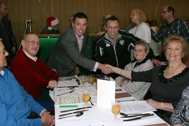 Mark Aston with some of the guests at the dinner for those lonely this Christmas at Owlerton Stadium in 2011