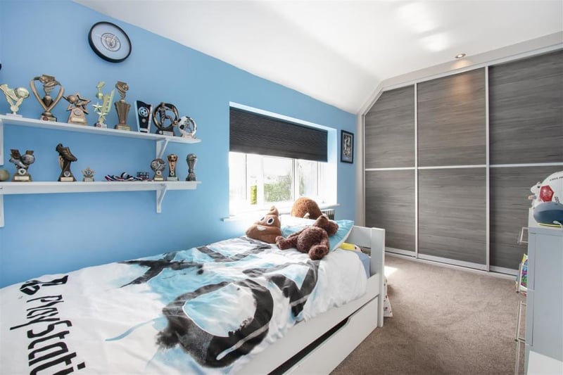 Bedroom four is a generously proportioned room with fitted wardrobes.