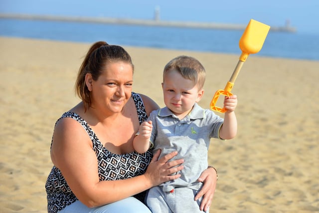 Claire Chrisp with son Kyle Atkinson, 2, on Sandhaven beach in 2016.