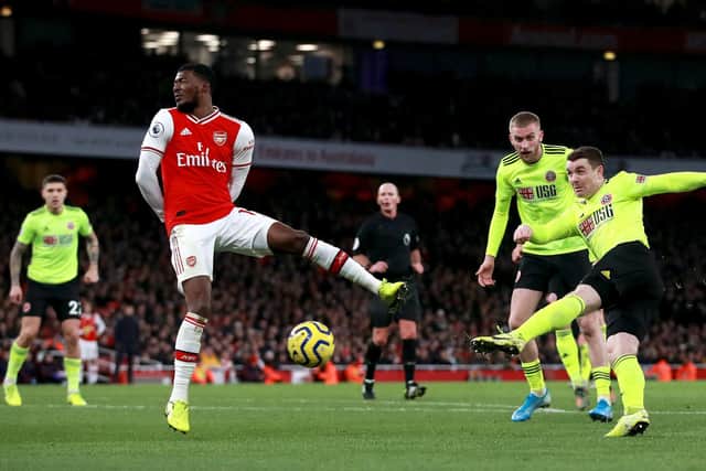 Sheffield United's John Fleck (right) scores his sides first goal during the Premier League match at the Emirates Stadium, London. PA Photo. Picture date: Saturday January 18, 2020. See PA story SOCCER Arsenal. Photo credit should read: Adam Davy/PA Wire. RESTRICTIONS: EDITORIAL USE ONLY No use with unauthorised audio, video, data, fixture lists, club/league logos or "live" services. Online in-match use limited to 120 images, no video emulation. No use in betting, games or single club/league/player publications.
