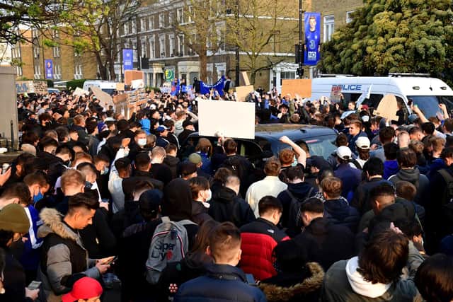 A taxi gets stuck as fans protest against Chelsea's involvement in the new European Super League: Ian West/PA Wire